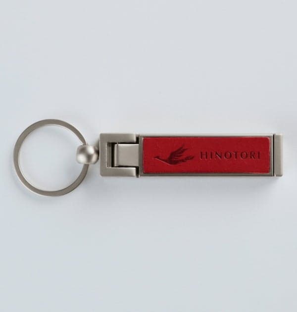 Smartphone stand and bag hanger in keychain form