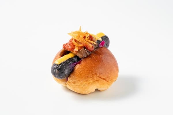 Black Cat's Mischief hot dog with bamboo charcoal sausage