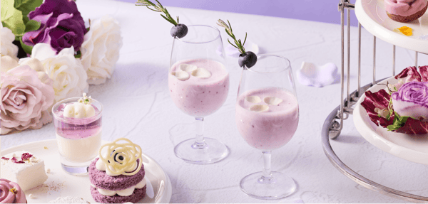 Purple Cloud mocktail with edible rose and blueberries