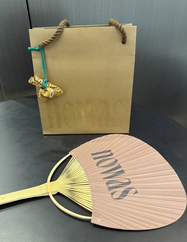 Original scented sachet and fan given as a purchase bonus