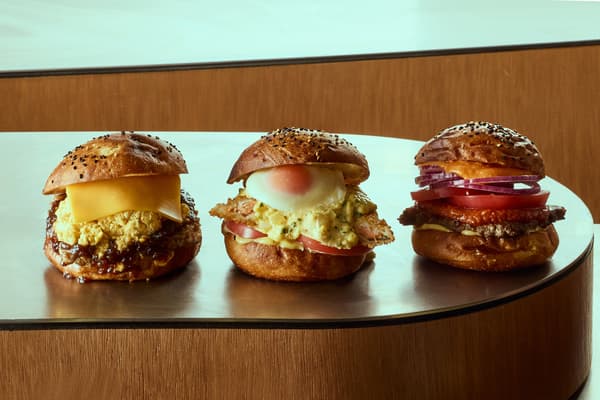 Three store-exclusive new burgers: Teriyaki Egg Salad Cheese Burger, Lemon Tartar Salmon Egg Burger, and Double Salsa Cheese Junky Burger (from left)