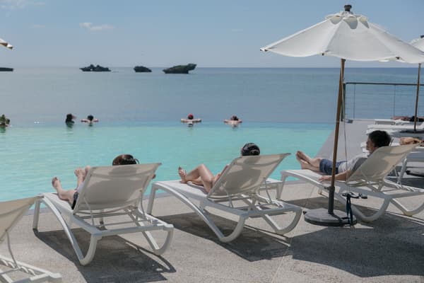 Poolside chairs facing the sea at the lagoon