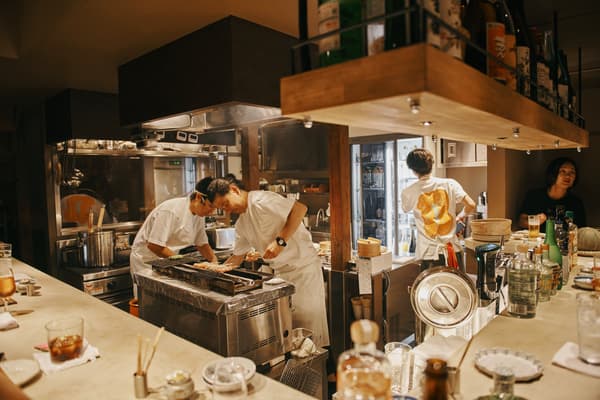 Chowa interior — 1F counter seating surrounding the open kitchen