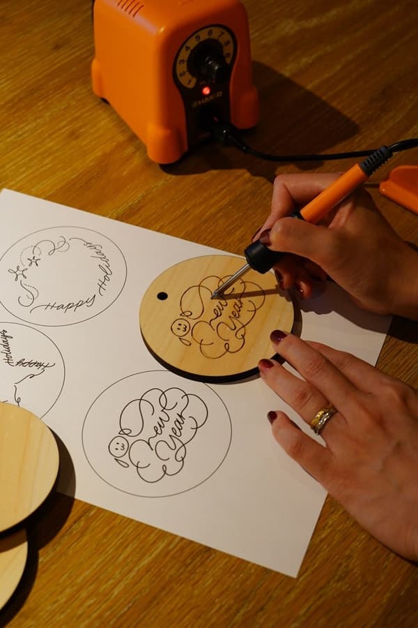Modern calligraphy and wood burning charm making