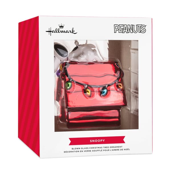 Adorno de cristal de una caseta de perro roja iluminada