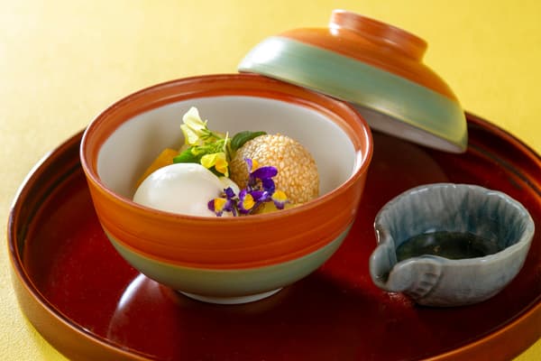 Mango and Melon Compote with Sesame Dumplings and Vanilla Ice Cream, served with Wildflower Honey