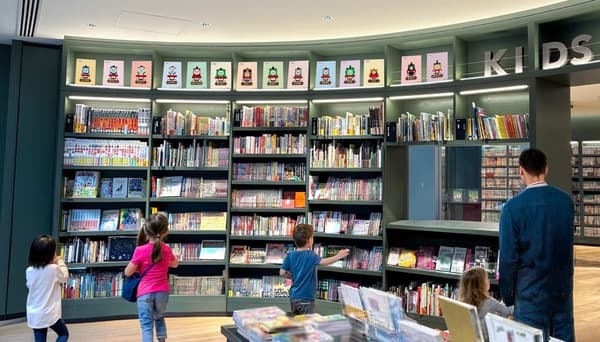 Children's book shelves with Thomas illustrations on display