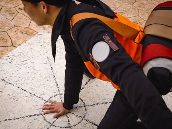 Visitor performing the Summoning Jutsu hand seal on the ground circle