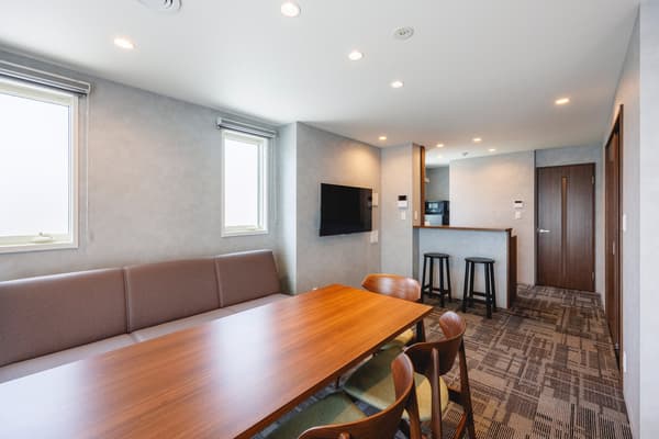 Guest room with a living, dining, and kitchen area