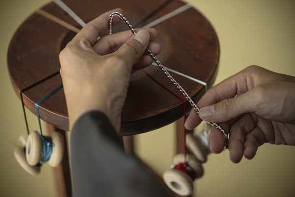 Carefully braiding a kumihimo cord