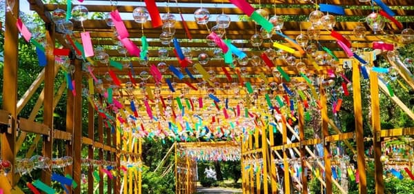 The 200-meter wind chime tunnel leads to the Yakushi Nyorai statue