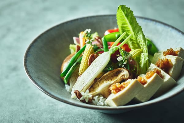 In-room dining: Nourish Bowl with grilled vegetables, rice, and salad