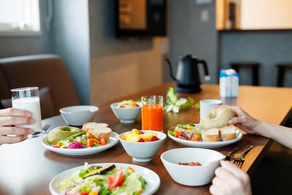 Guests sharing a home-style meal at the in-room dining table