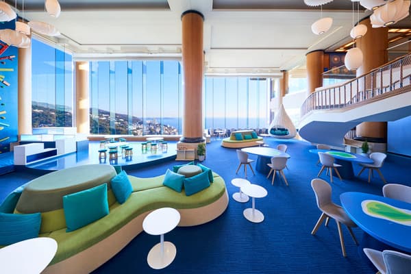 Risonare Atami's atrium space evoking Sagami Bay