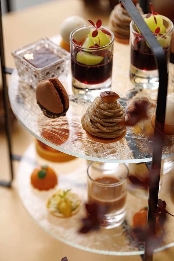 Twelve sweet and savory items on the tea stand