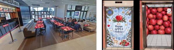 Apple-themed tables in the food court and apple-wrapped elevators