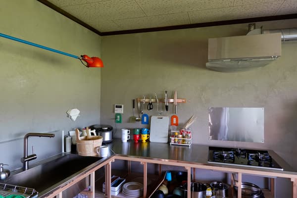 The full kitchen with a stainless-steel counter