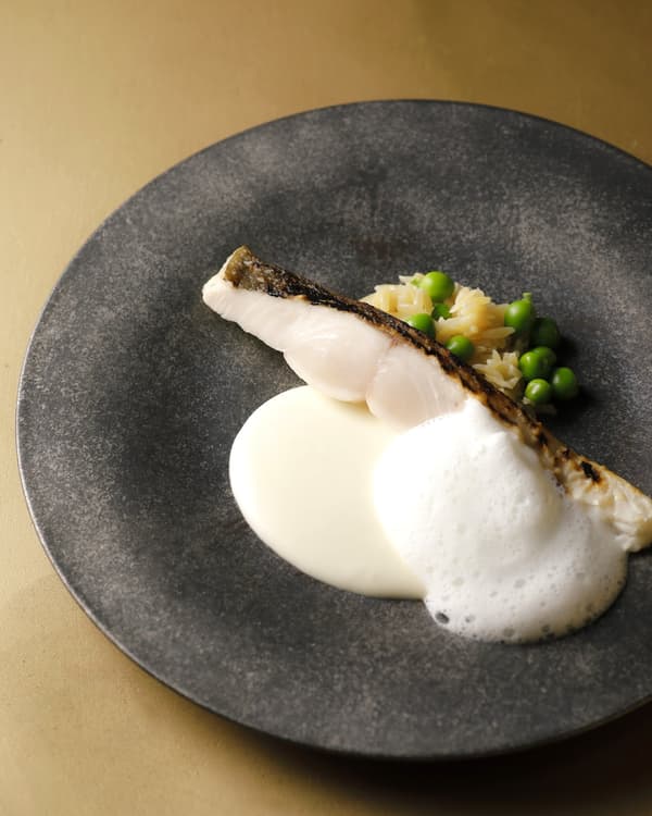 Charcoal-grilled managatsuo (silver pomfret), finished with a sauce balancing tomato and fermented butter