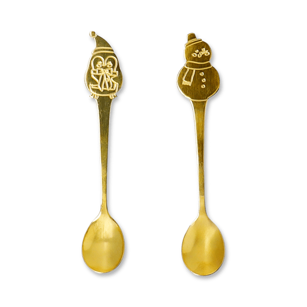 Dessert spoons with a penguin and a snowman