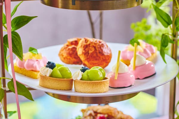 The afternoon tea stand featuring peach and Shine Muscat