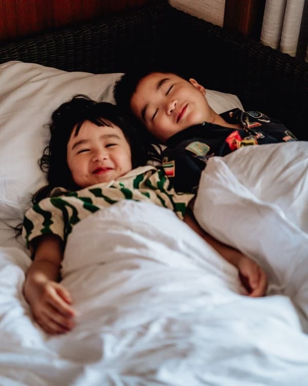 Children resting in bed