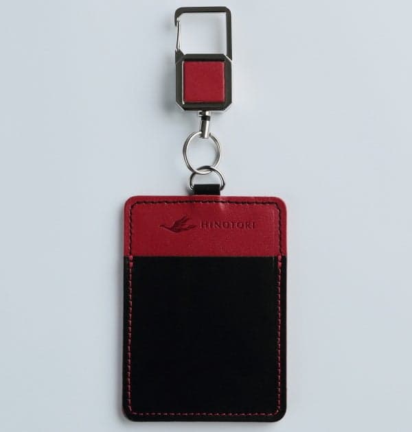 IC card case with reel in black and red, front