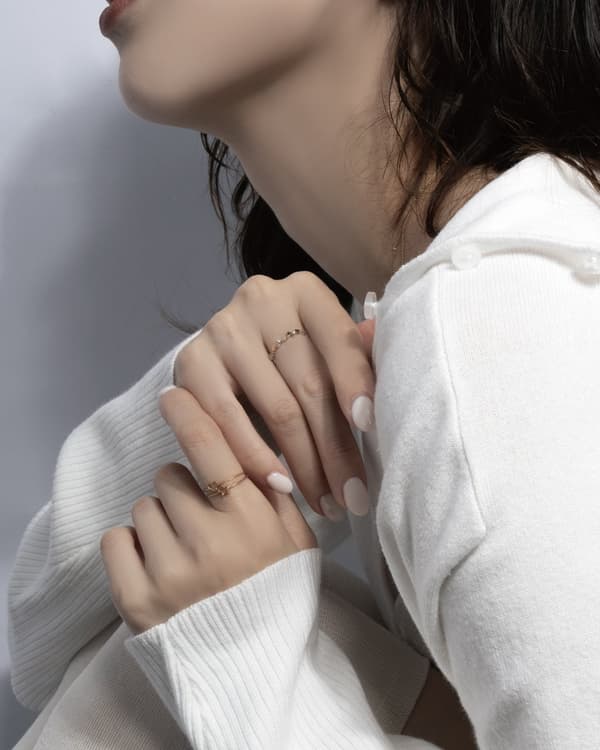 Styling image of little emblem jewelry