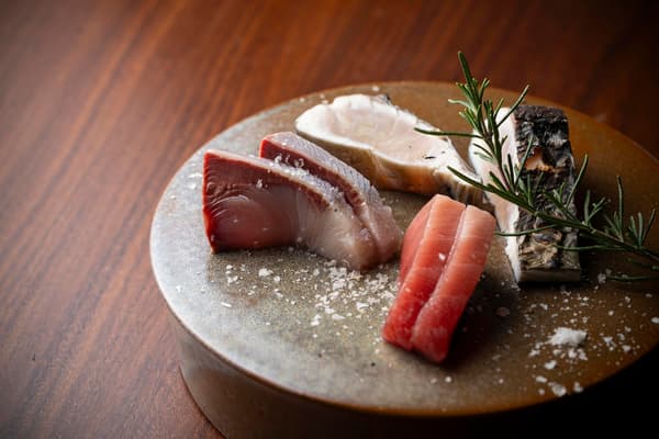 Chef preparing seasonal local ingredients at the private dining counter