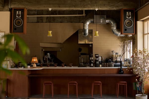 A multi-purpose space combining a cafe, lifestyle goods, studio, and gallery