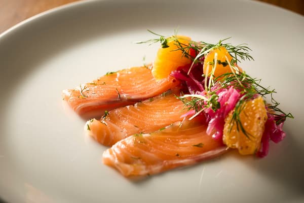 Fuji Atlantic Salmon marinade with pickled red cabbage, orange, and dill