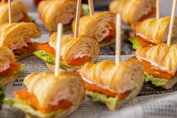 Smoked salmon and strawberry-flavored croissant sandwich