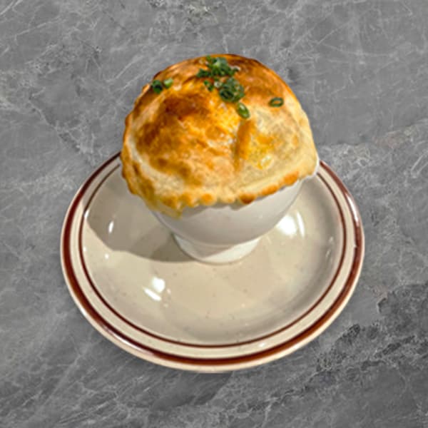 Le Foyer Signature Onion Soup - served with a puff pastry dome