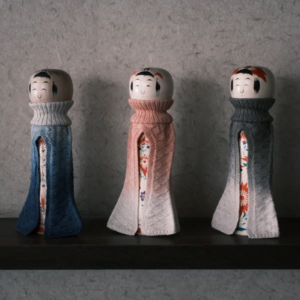 Kokeshi Dressed in Knit — traditional kokeshi dolls wearing hand-knit garments
