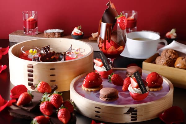 Strawberry and chocolate sweets, a parfait and cacao scones served on wooden trays