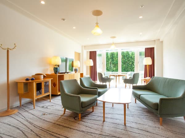Guest room with beautifully curved furniture (Forest Floor Suite living room)
