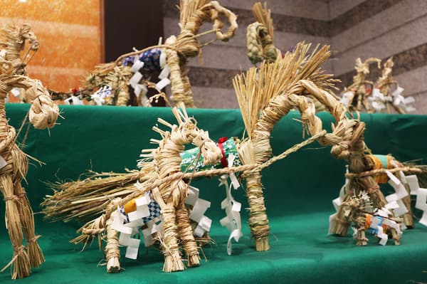 Straw horses lined up in the lobby