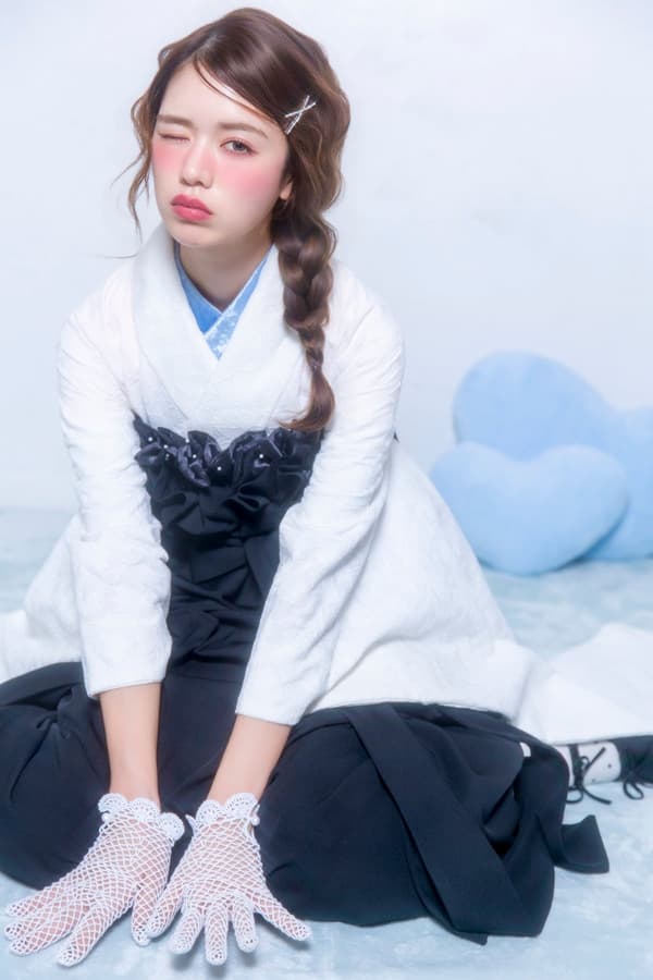 Braided-down hairstyle with silver accessories