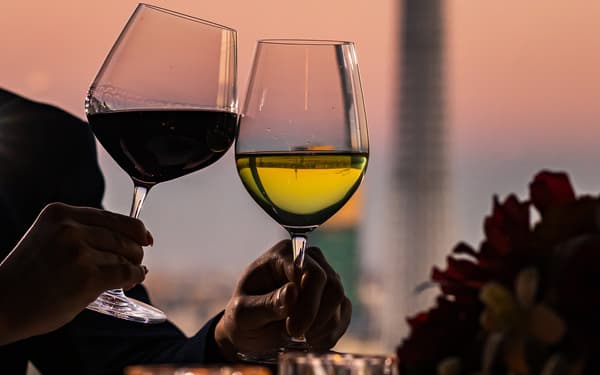 Couple toasting at sunset