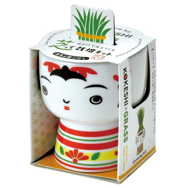 01 Ochobo - Charming kokeshi with distinctive red lipstick and cute pursed lips. Dressed in a vibrant red floral kimono with equally gorgeous hair ornaments, creating an endearing presence that brings joy as interior decoration or gifts.