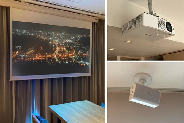 Theater room equipped with large screen and surround sound system