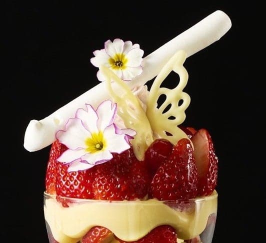 The top of the parfait with a white chocolate butterfly and flower petals heralding the arrival of spring