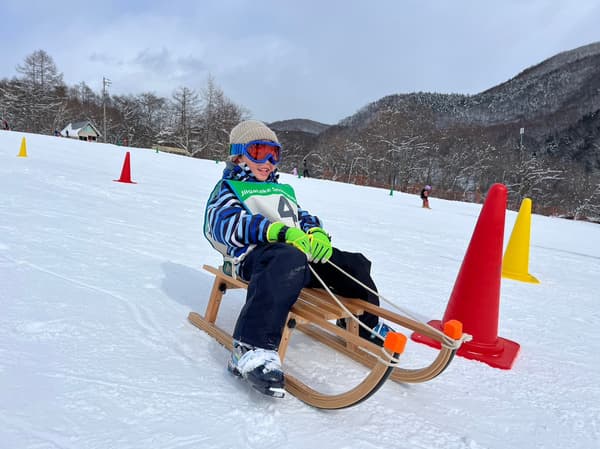 Snow luge participants