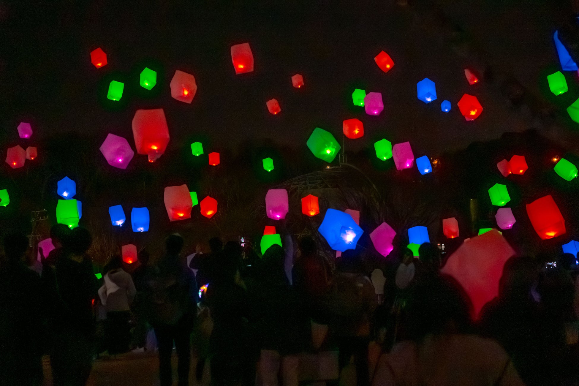 Sky lanterns glowing in the night sky