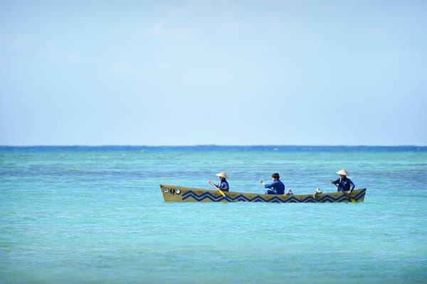 Paddling a traditional Sabani boat along the Okinawan coast