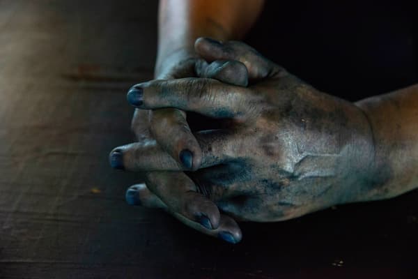 Artisan's hands and nails dyed indigo