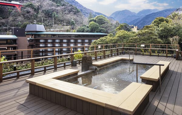 The renovated outdoor foot bath with expanded views of Hakone's majestic mountains