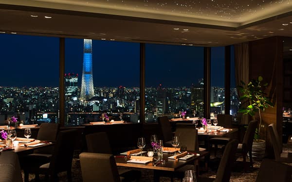 Spacious restaurant interior with night views