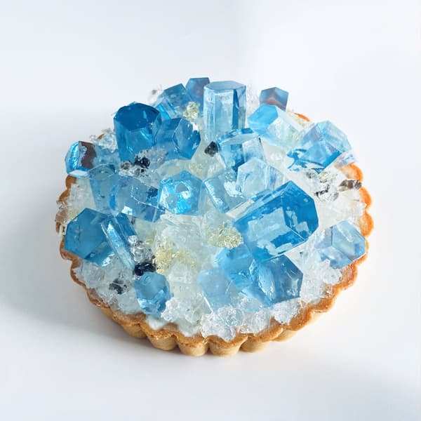 Aquamarine kohakuto candy arranged to recreate the mineral's distinctive 3D form, glittering like the real thing