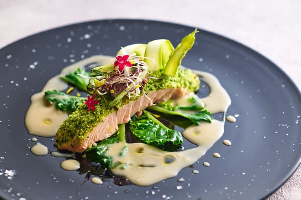 Herb-crusted salmon with citrus chai sauce