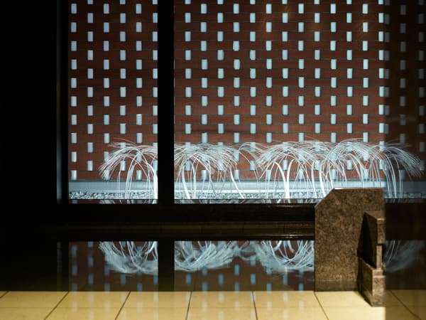 Courtyard with artwork visible from the large public bath